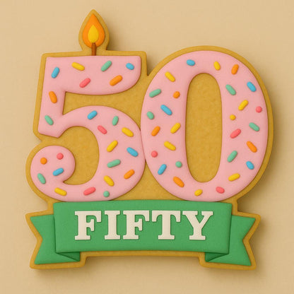 A sugar cookie shaped like the number 50 with pink icing, rainbow sprinkles, a small orange flame on top, and a green banner below reading “FIFTY” in white letters.