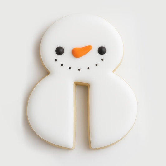 A white snowman-shaped cookie designed as a mug hugger, decorated with a smiling face, black eyes and dots for a mouth, and an orange carrot nose. The cookie has a small cutout at the bottom to fit securely on a mug, creating a charming winter accent.
