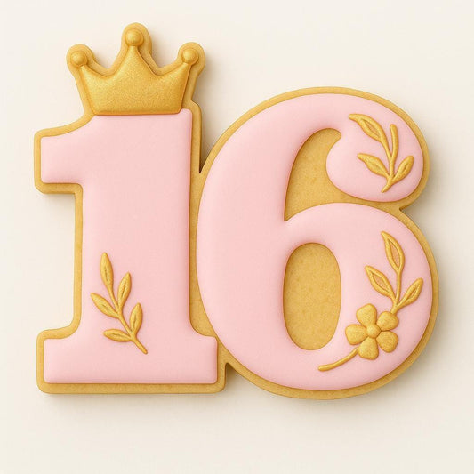 A pink sugar cookie shaped like the number 16 with a small gold crown on top and golden floral accents decorating the numbers, representing a Sweet 16 birthday celebration.