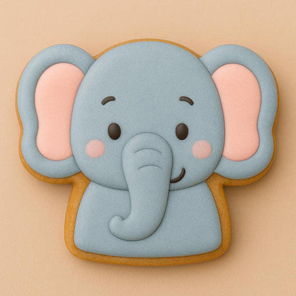 A sugar cookie shaped like a smiling elephant with gray icing, pink inner ears, and blushing cheeks on a light beige background.