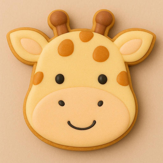A sugar cookie shaped like a smiling giraffe’s face, decorated with light yellow and tan icing, brown spots, and black eyes on a beige background.