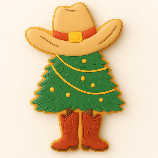Decorated sugar cookie shaped like a Christmas tree wearing a cowboy hat and red boots with yellow garland lights.